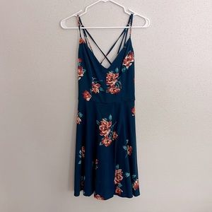 Navy blue strappy dress with orange flowers